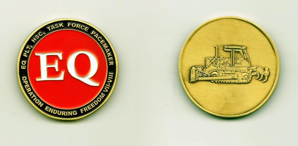 Round shaped, antique brass colored coin, 1-9/16 inches in diameter.