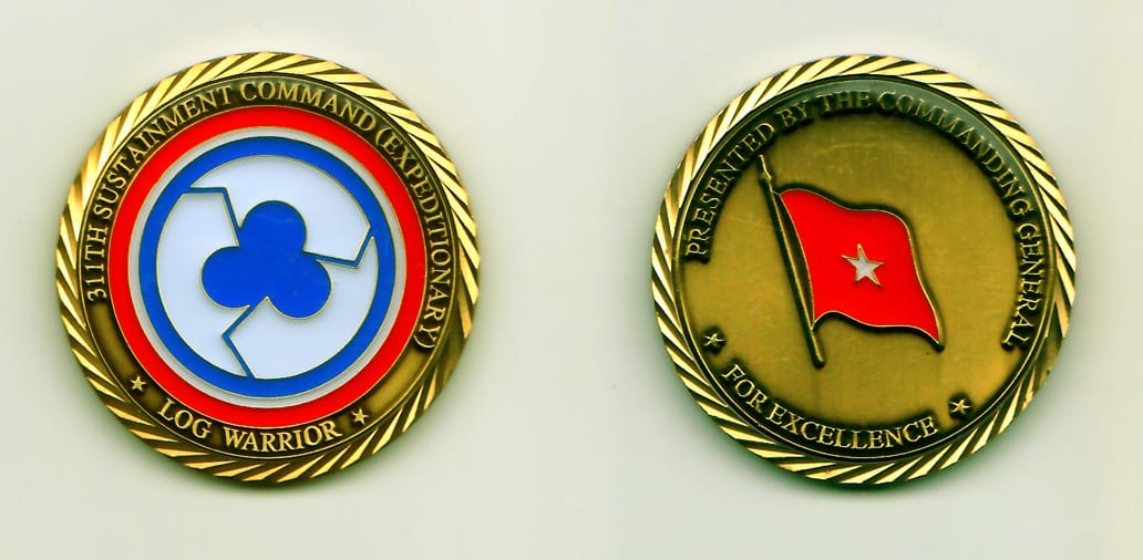 Round shaped, brass colored coin, 1-3/4 inches in diameter.