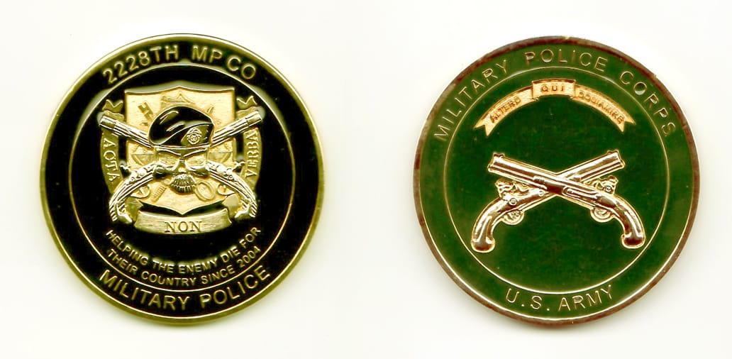 Round shaped, gold colored coin, 1-7/8 inches in diameter.