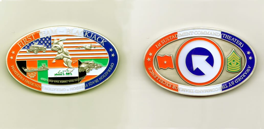 Oval shaped, silver colored coin, 2-7/8 inches wide x 1-1/2 inches high.