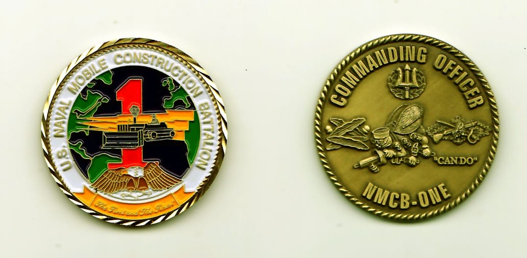 Round shaped, gold colored coin, 1-1/2 inches in diameter.