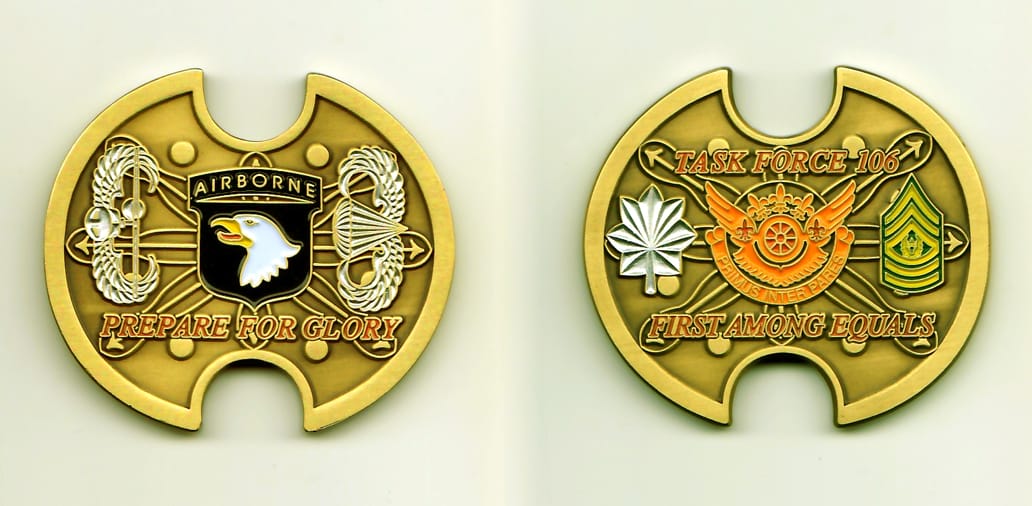 Oval  shaped with half-circle notches cut out on top and bottom edges, antique gold colored coin, 1-7/8 inches wide x 1-...