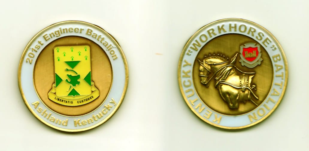 Round shaped, gold colored coin, 1-5/8 inches in diameter.