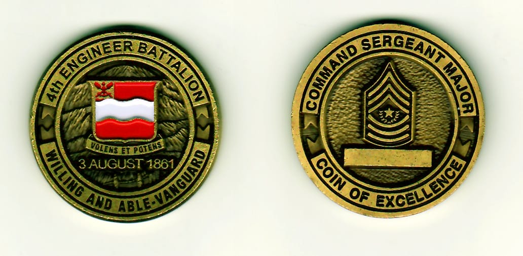 Round shaped, brass colored coin, 1-3/8 inches in diameter.