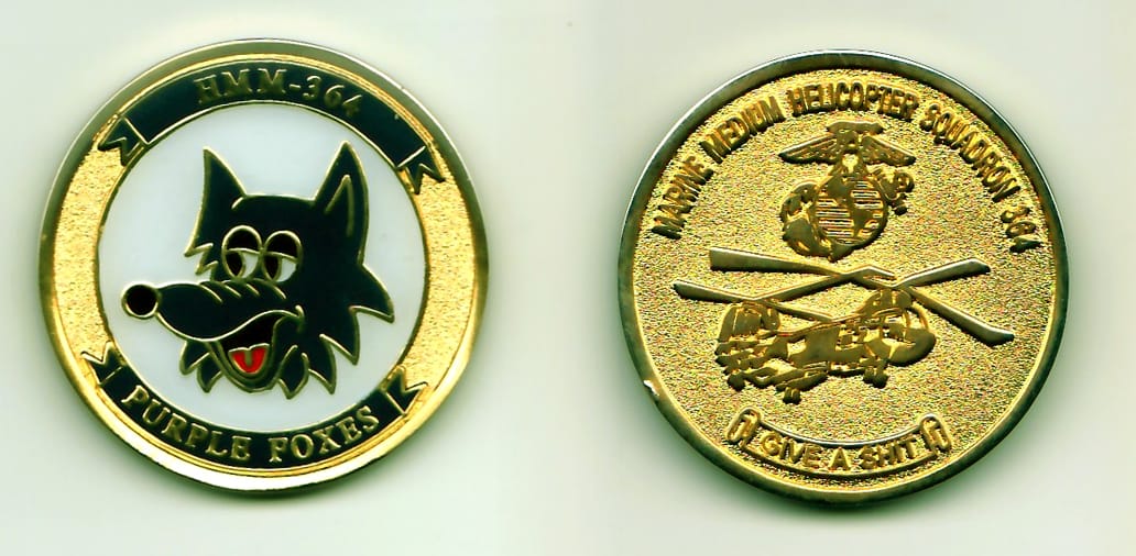 Round shaped, gold colored coin, 1-1/4 inches in diameter.