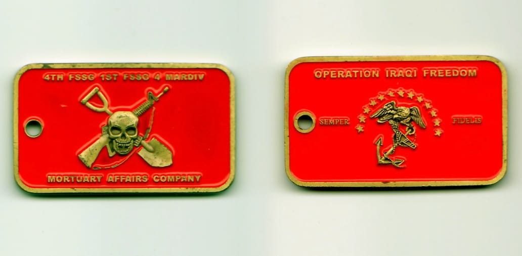 Retangular shaped with hole for chain, antique brass colored coin, 1-1/4 inches high x 2-1/4 inches wide.