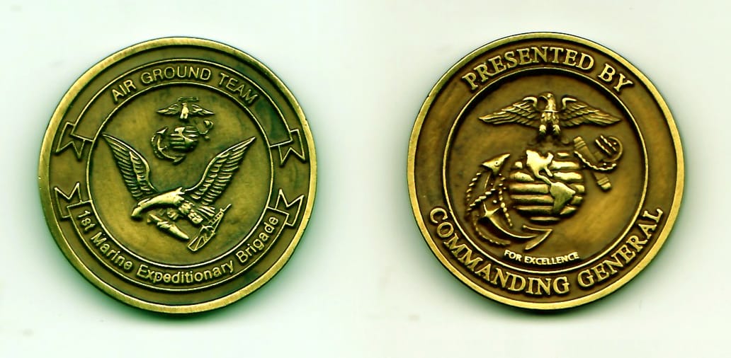 Round shaped, antique brass colored coin, 1-1/4 inches in diameter.