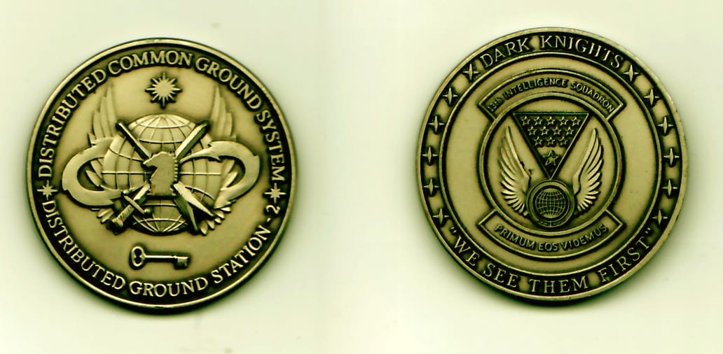 Round shaped, pewter colored coin, 1-3/8 inches in diameter.