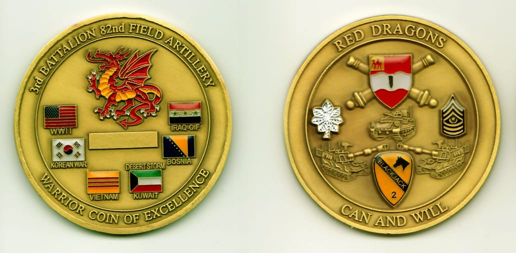 Round shaped, gold colored coin, 2-3/8 inches in diameter.