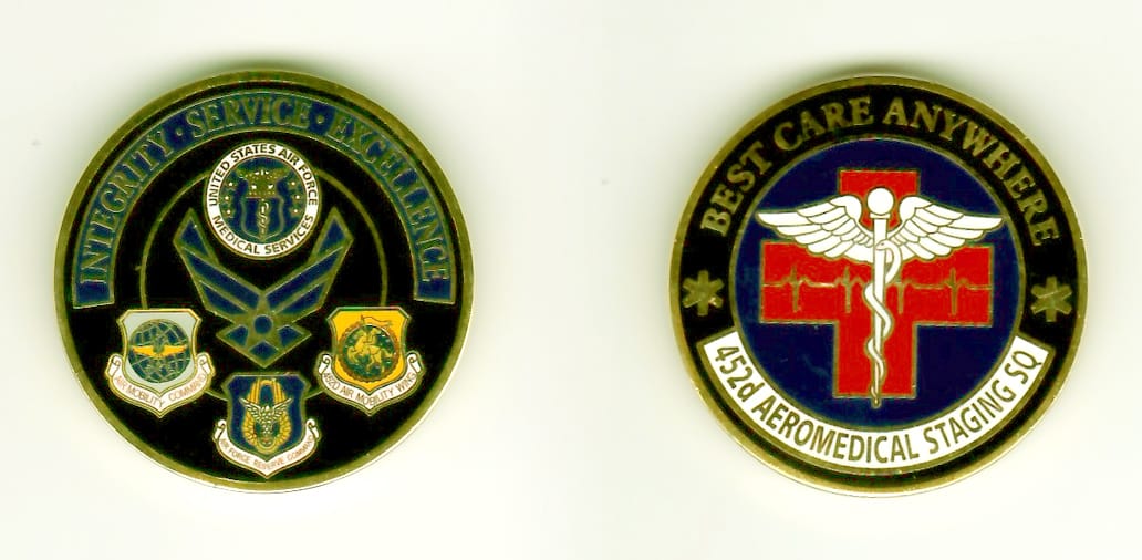 Round shaped, gold colored coin, 1-1/4 inches in diameter.