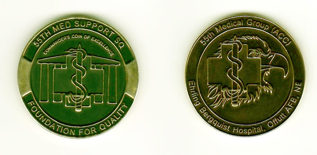 Round shaped, gold colored coin, 1-1/2 inches in diameter.