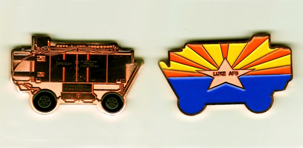 APC shaped, copper colored coin, 1-1/4 inches high x 2-1/16 inches wide.