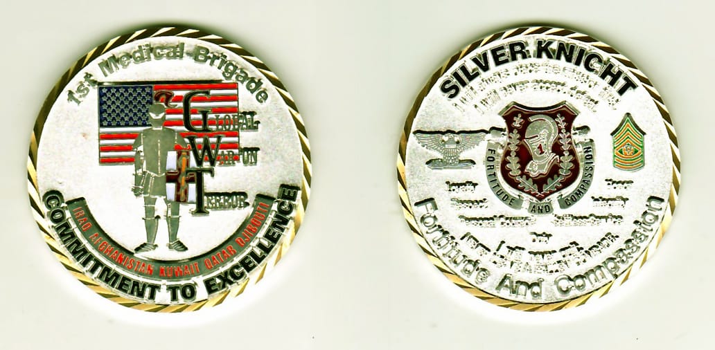 Round shaped, silver colored coin with light gold rim, 2 inches in diameter.