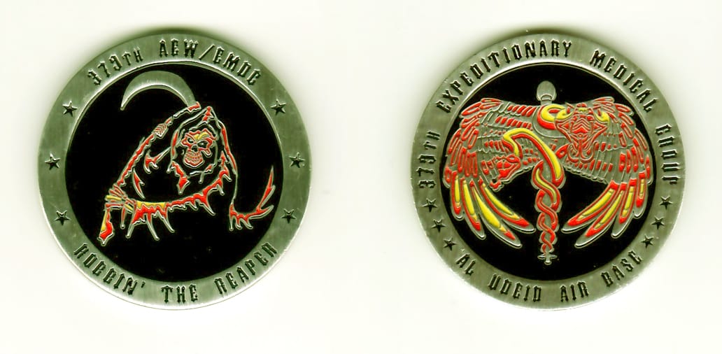 Round shaped, silver colored coin, 1-11/16 inches in diameter.