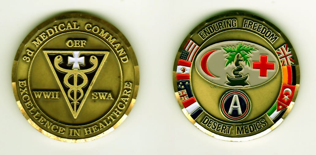 Round shaped, antique gold colored coin, 1-13/16 inches in diameter.