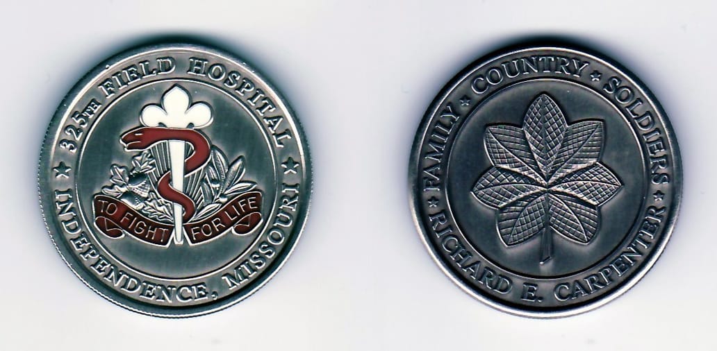 Round shaped, pewter colored coin, 1-1/2 inches in diameter.