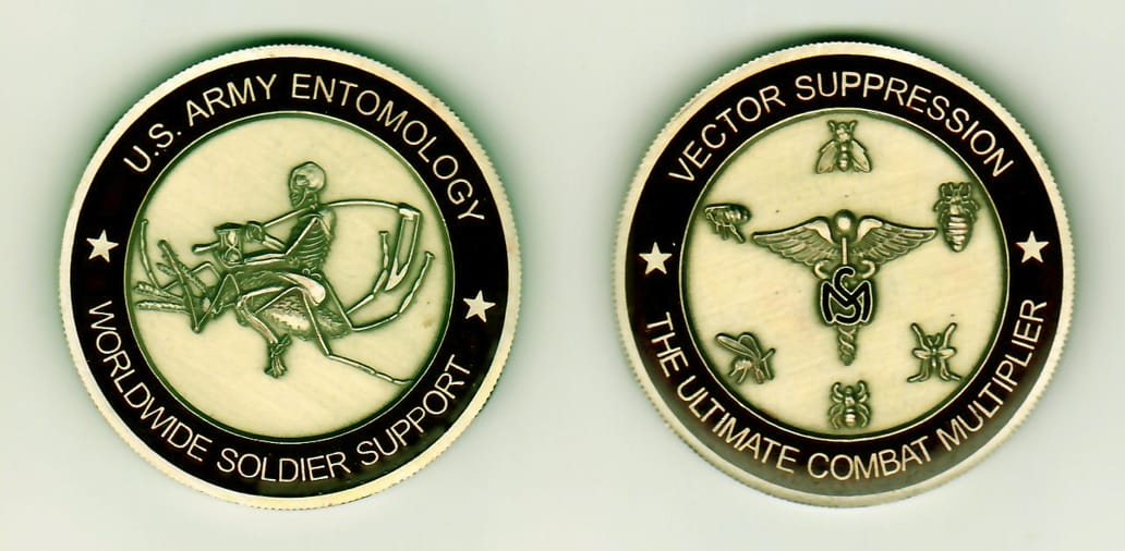 Round shaped, antique gold colored coin, 1-13/16 inches in diameter.