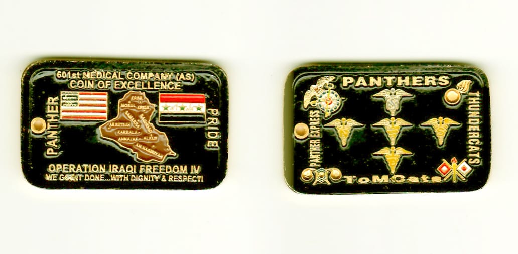 Retangular shaped, gold colored coin, 1-1/4 inches high x 1-1/2 inches wide.