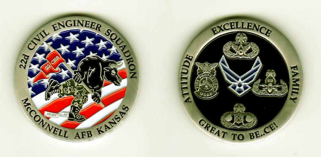 Round shaped, silver colored coin, 1-1/4 inches in diameter.