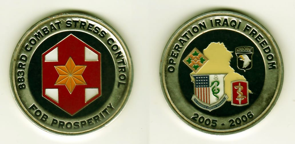 Round shaped, silver colored coin, 2-1/8 inches in diameter.