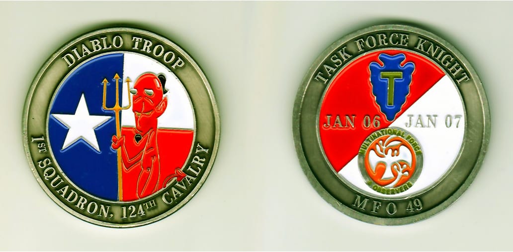 Round shaped, pewter colored coin, 2 inches in diameter.