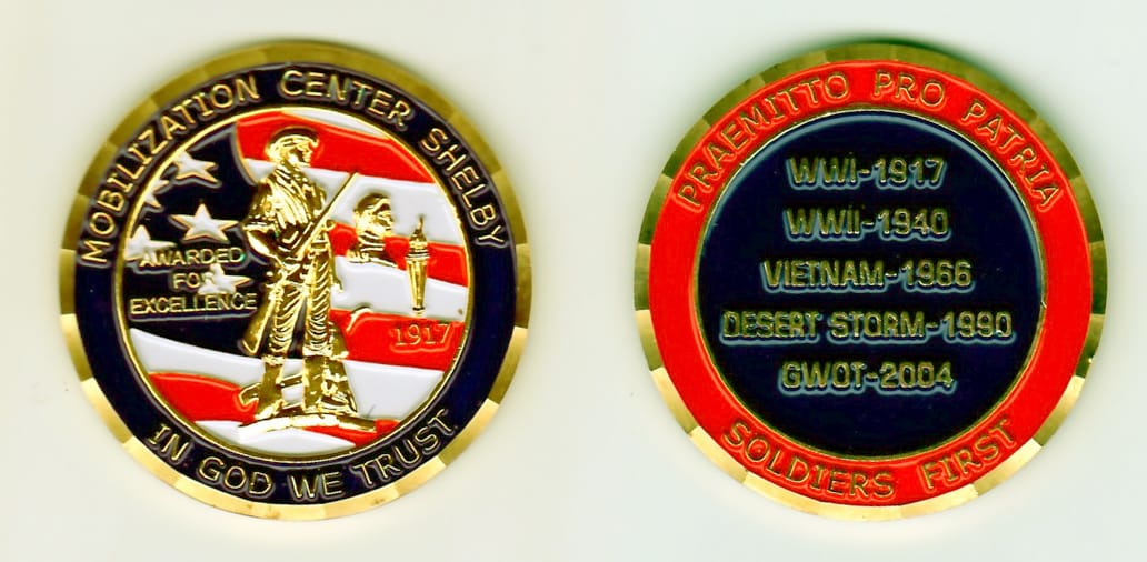 Round shaped, gold colored coin, 2-1/8 inches in diameter.