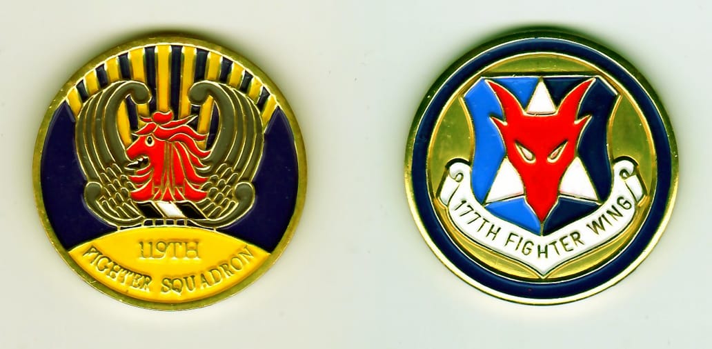 Round shaped, gold colored coin, 1-11/16 inches in diameter.