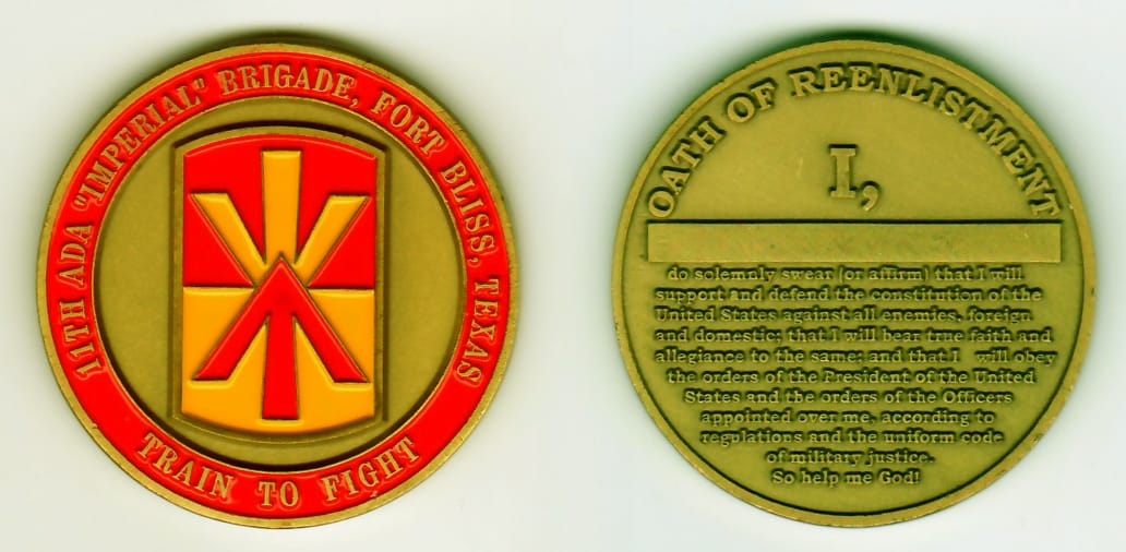 Round shaped, antique gold colored coin, 2 inches in diameter.