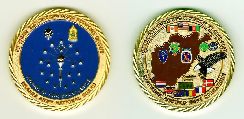 Round shaped, gold colored coin, 2 inches in diameter.