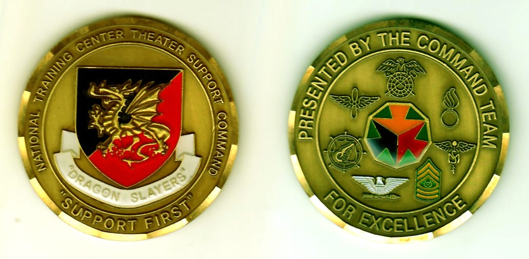 Round shaped, antique gold colored coin, 2 inches in diameter.