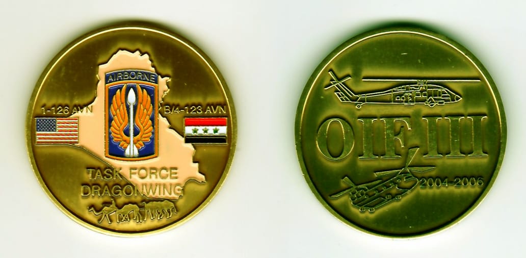 Round shaped, antique gold colored coin, 1-13/16 inches in diameter.