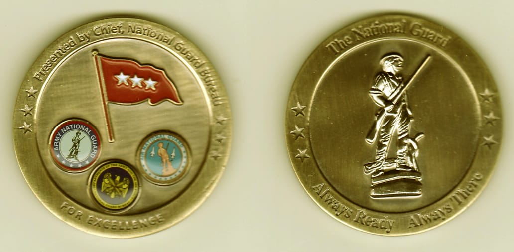 Round shaped, brushed brass colored coin, 2- 1/8 inches in diameter.