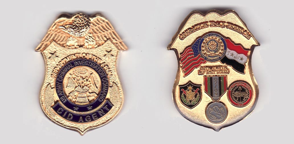 Shield shaped with eagle resting on top, gold colored coin, 1- 1/4 inches x 2 inches high.