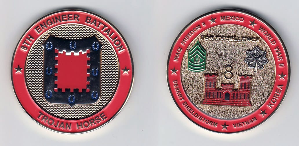 Round shaped, gold colored coin, 2- 1/8 inches in diameter.