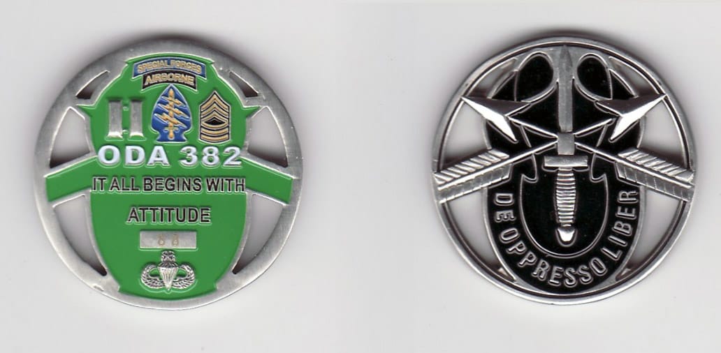 Round shaped, silver colored coin with cut out areas, 1- 1/4 inches in diameter.