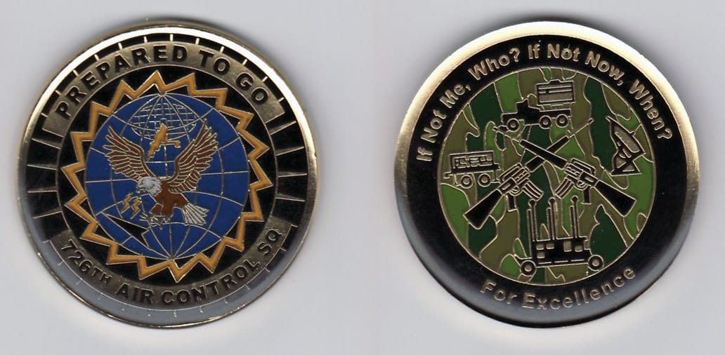 Round shaped, gold colored coin, 1- 13/16 inches in diameter.