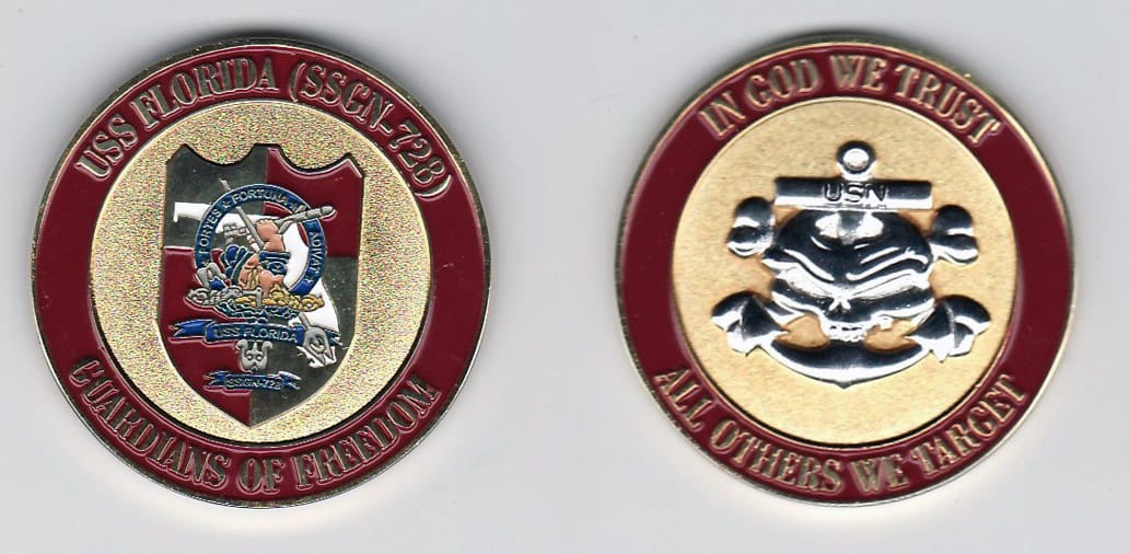 Round shaped, gold colored coin, 1- 1/4 inches in diameter.