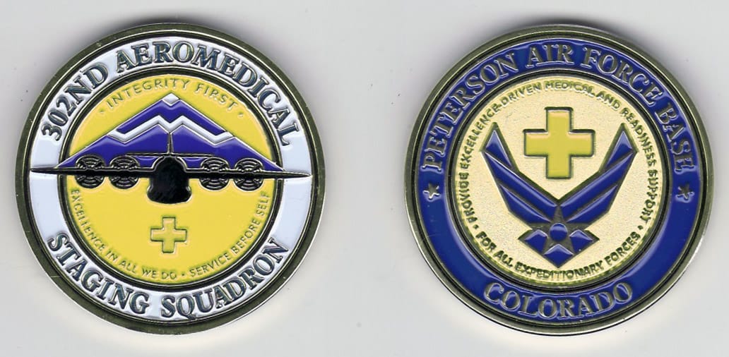 Round shaped, gold colored coin, 1-5/8 inches in diameter.