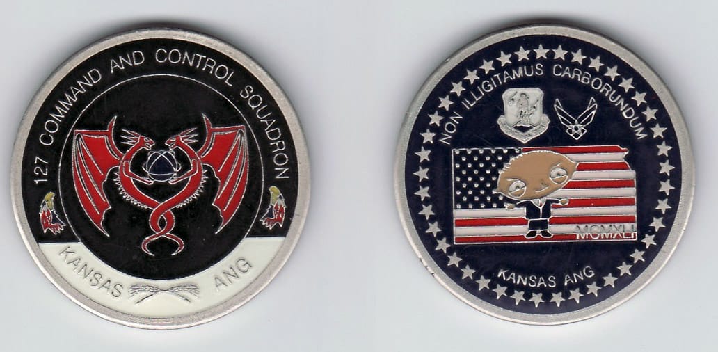 Round shaped, silver colored coin, 1-5/8 inches in diameter.