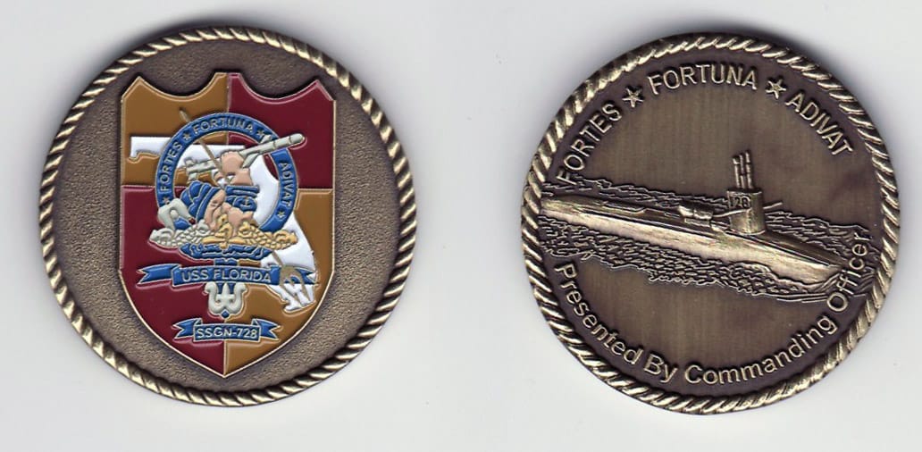 Round shaped, antique brass colored coin, 1- 1/4 inches in diameter.