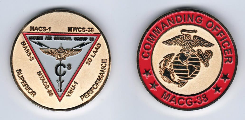 Round shaped, gold colored coin, 1- 13/16 inches in diameter.