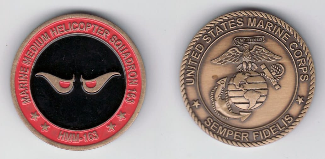 Round shaped,  brass colored coin, 1- 1/4 inches in diameter.