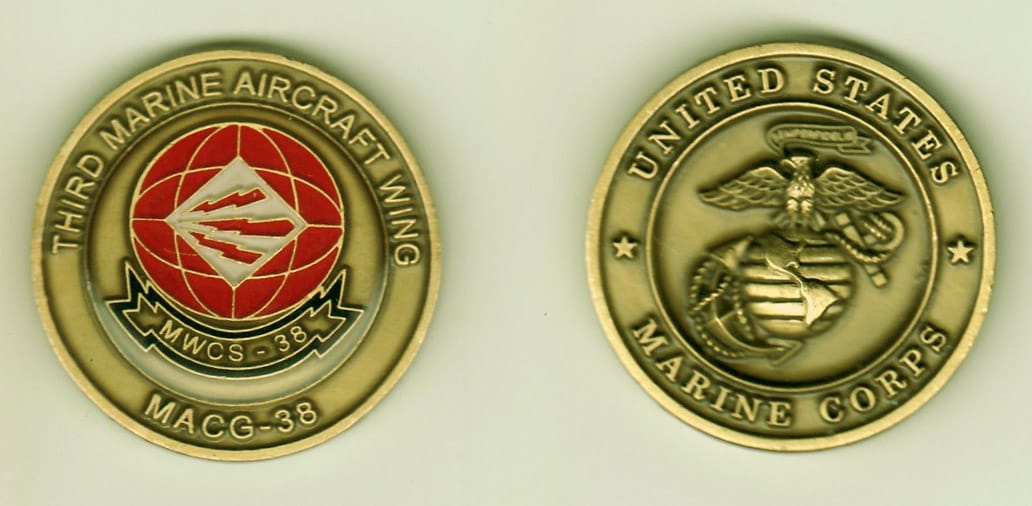 Round shaped, antique brass colored coin, 1- 1/4 inches in diameter.