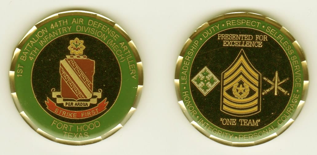 Round shaped, gold colored coin, 1-5/8 inches in diameter.