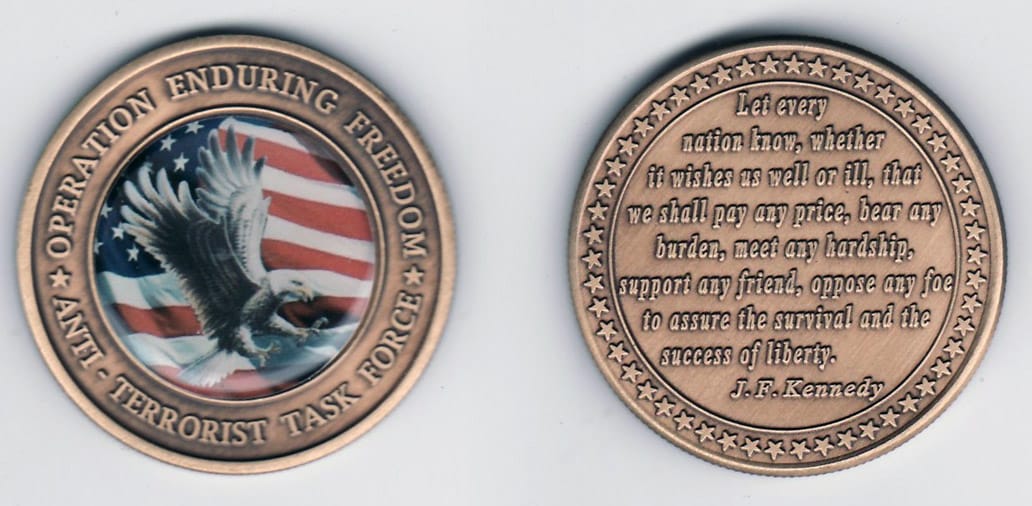 Round shaped, brass colored coin, 1- 13/16 inches in diameter.