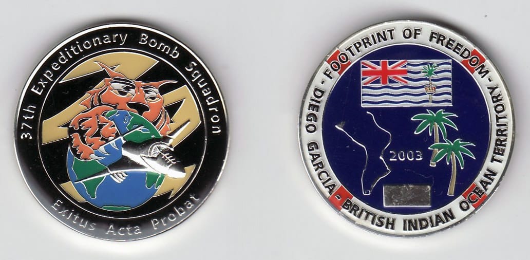 Round shaped, gold colored coin, 1- 9/16 inches in diameter.