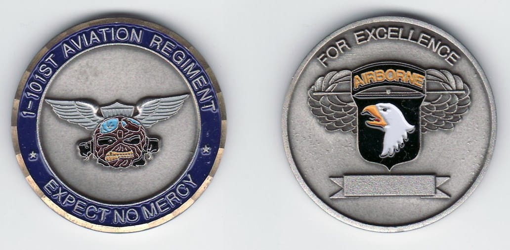 Round shaped, silver colored coin with gold colored rim, 1-5/8 inches in diameter.