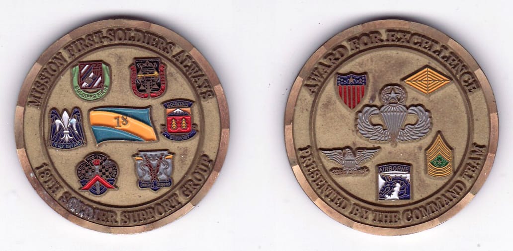 Round shaped, brass colored coin, 2- 1/8 inches in diameter.