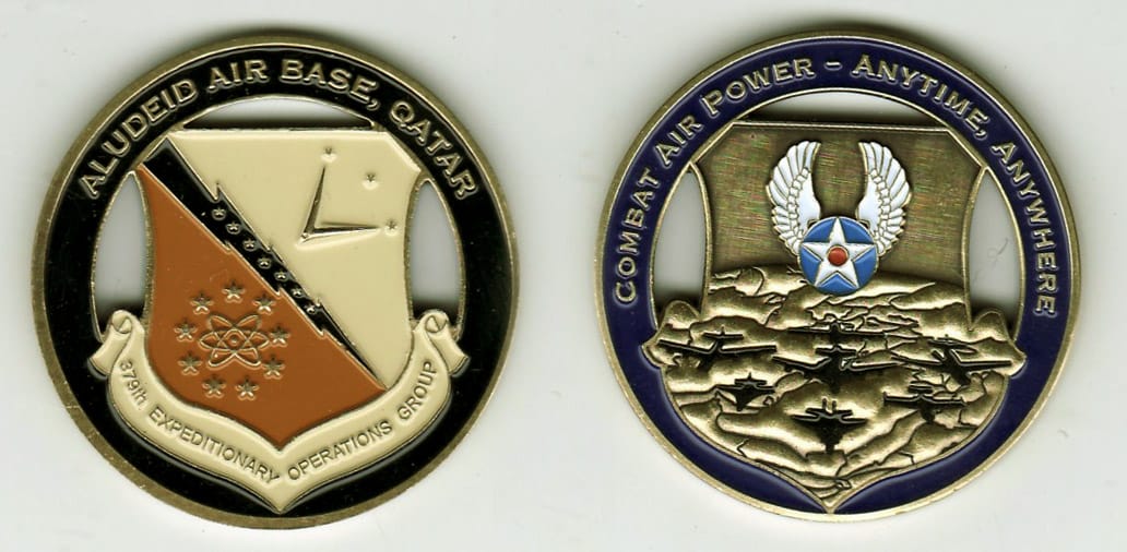 Round shaped,  brass colored coin with cut out areas, 1- 13/16 inches in diameter.