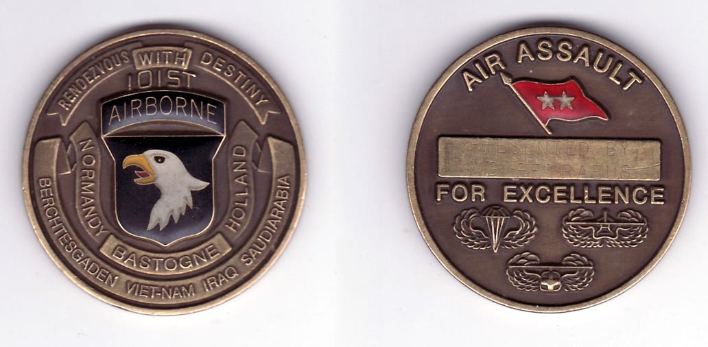 Round shaped, brass colored coin, 2 inches in diameter.